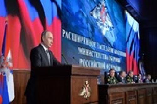 Putin urges military to act with determination against threats 