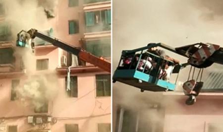 اقدام به موقع یک اپراتور جرثقیل باعث نجات جان ۱۴ نفر از آپارتمان در حال سوختن+فیلم